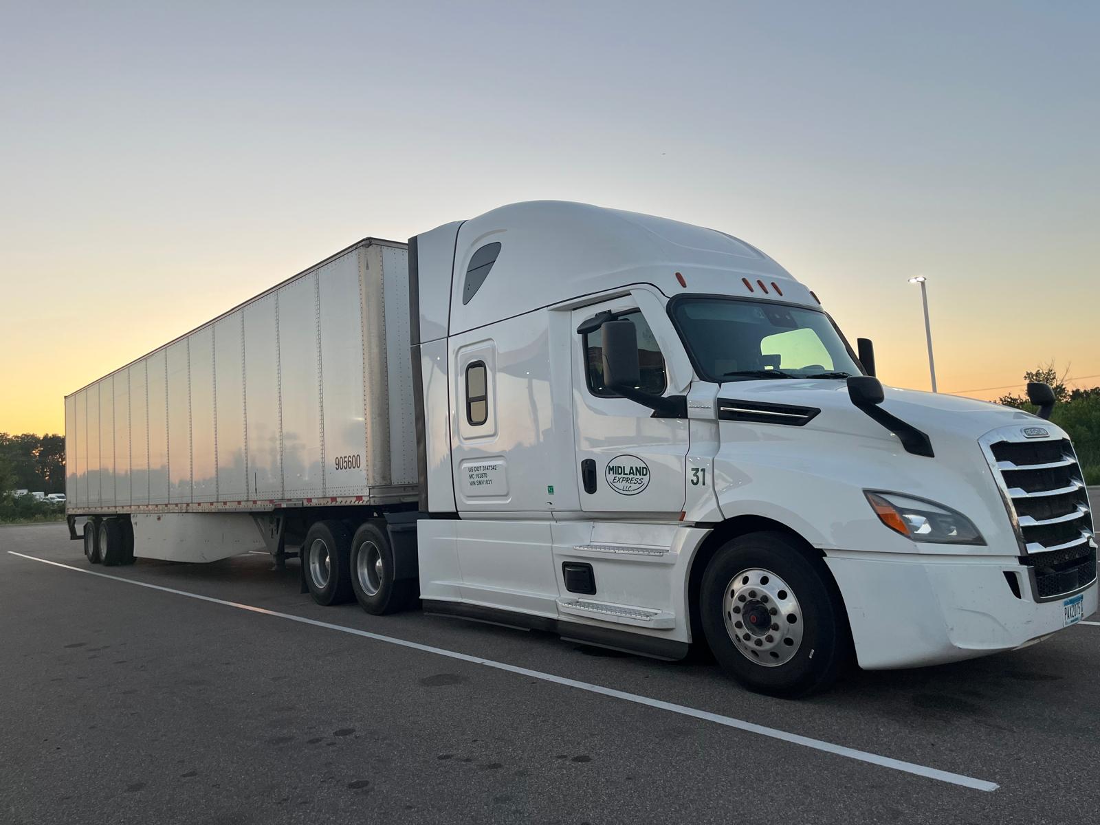 Midland Express dry van truck at sunset